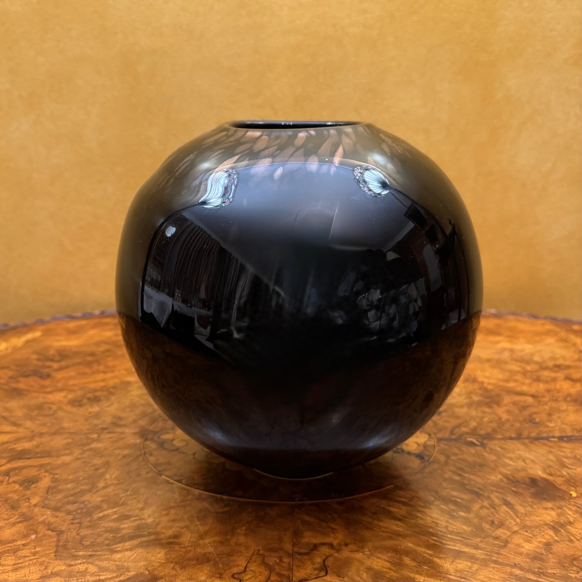 Round Black Sphere With Bronze Vase 